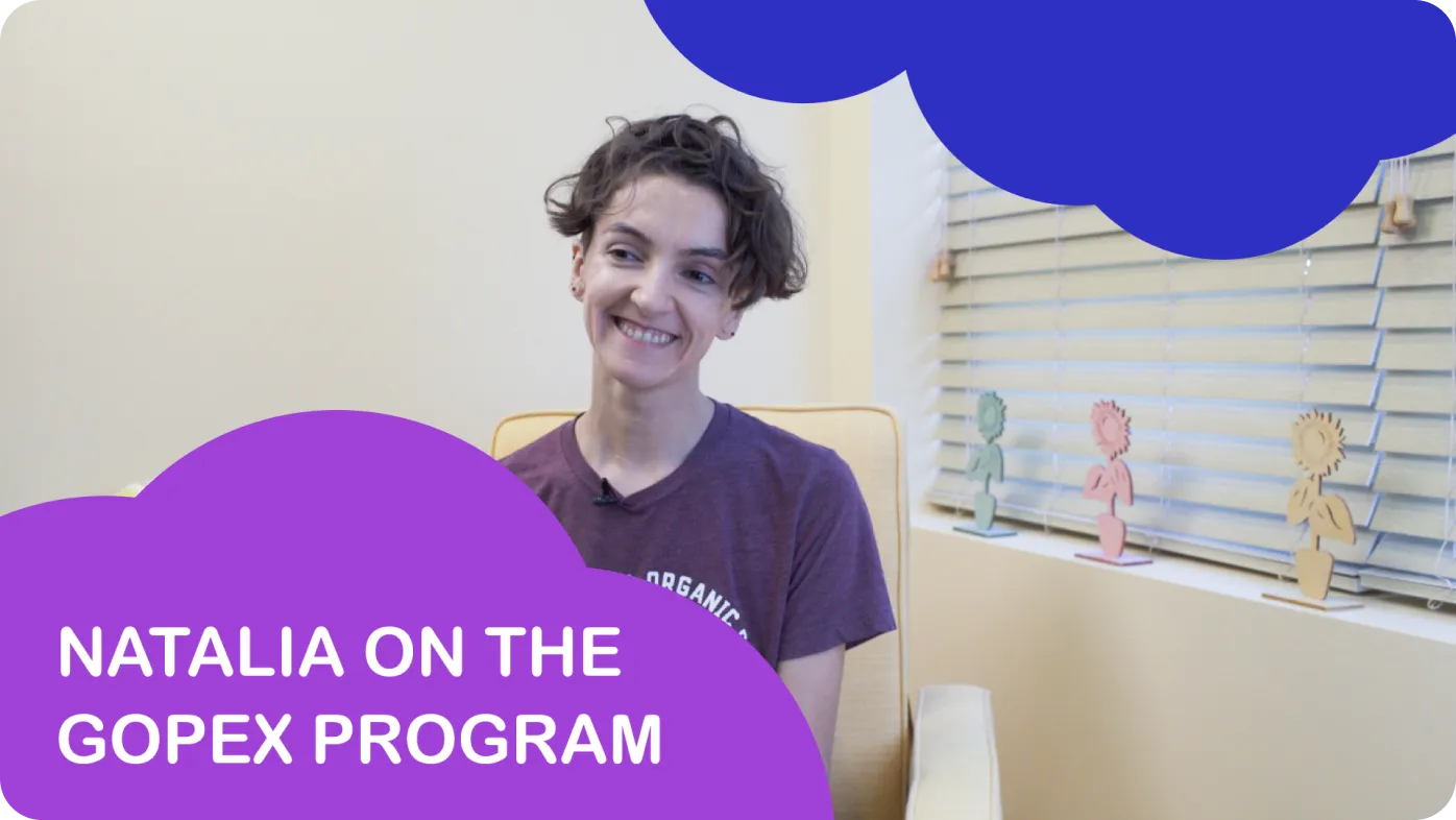 The image features a woman seated in front of a window with blinds, smiling at the camera, and there's text overlaying the image that reads 'Natália on the Gopex Program.