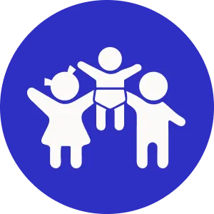 The image shows a family of four with a baby, standing together under a blue sign.