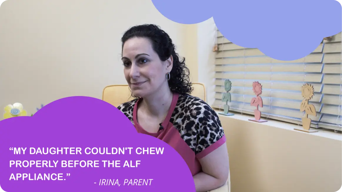 A woman sitting at a desk with a quote about her daughter above her head.